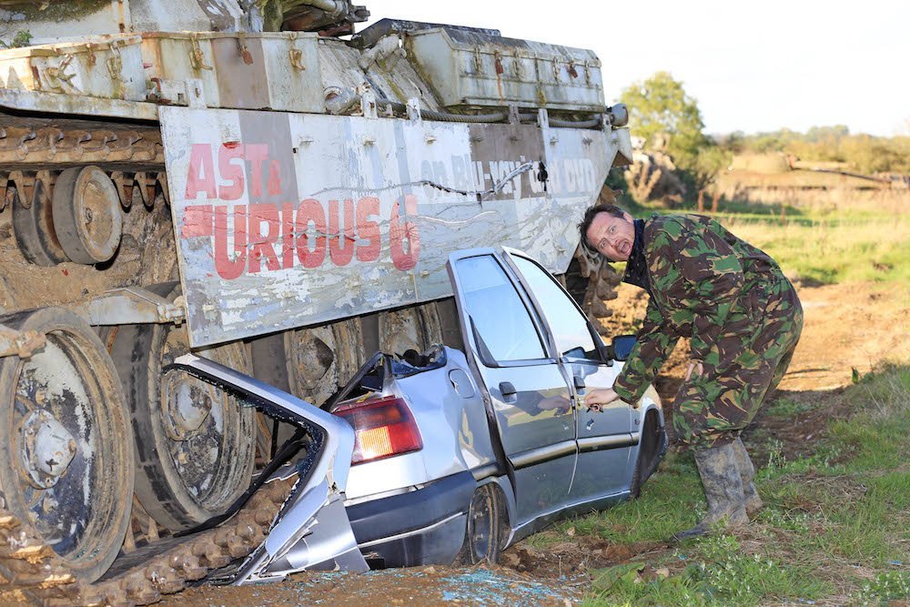 A Citroen ZX, under a Chieftan tank.