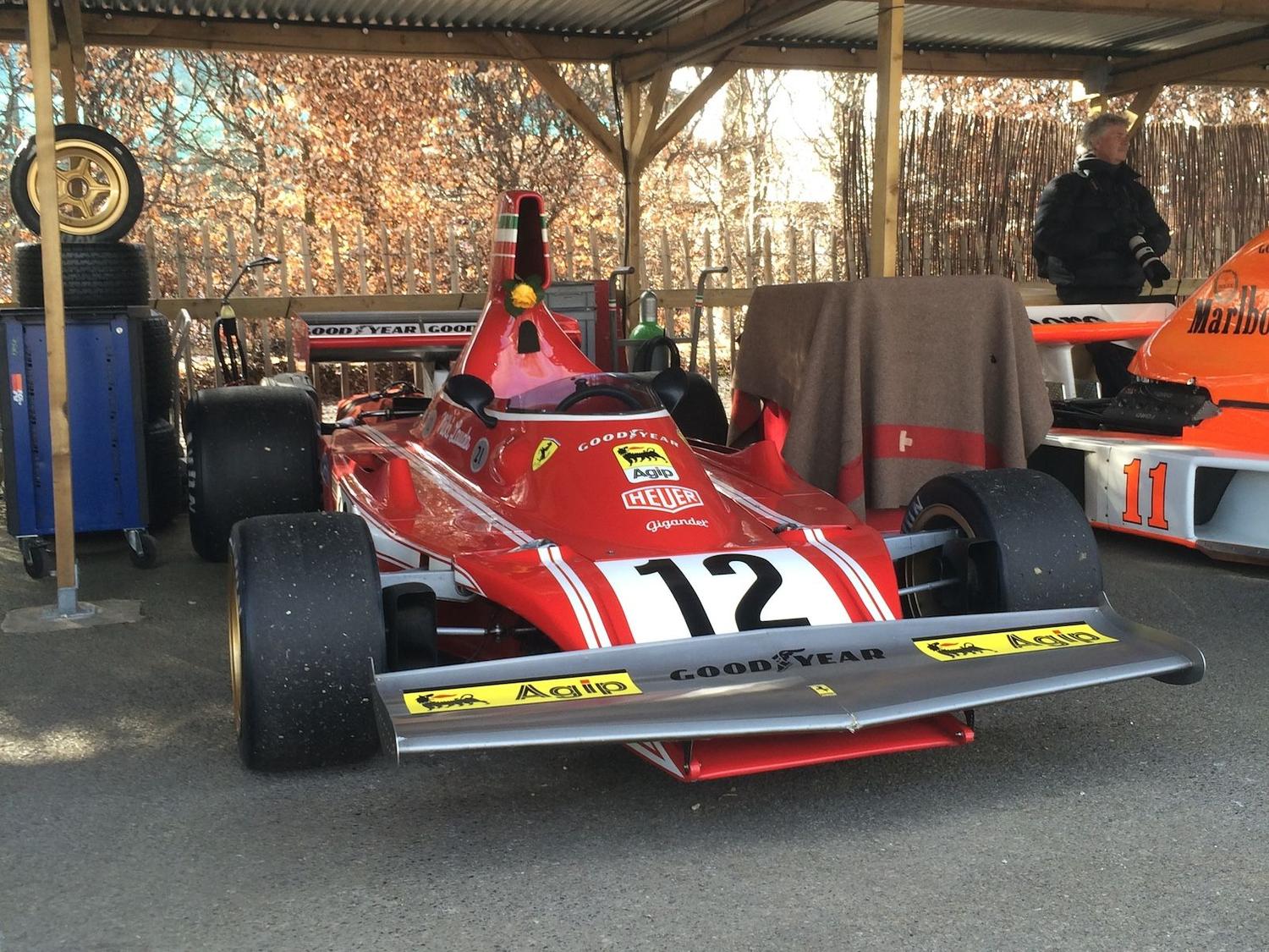 An ex-Niki Lauda Ferrari 312 B3 rests in the paddock at the 73rd Goodwood Members' Meeting
