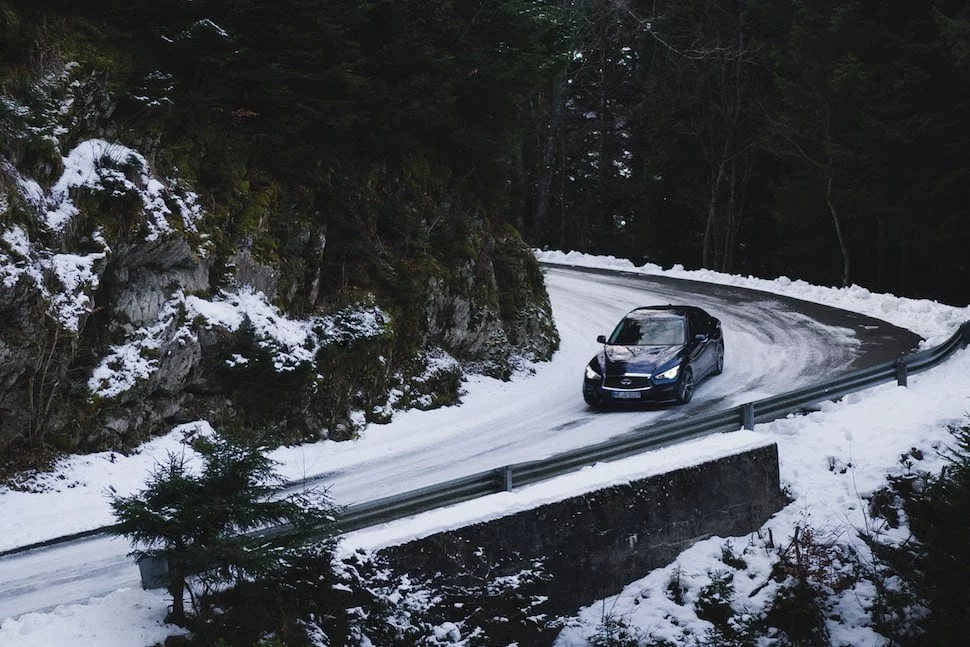 Infiniti Q50S Sport Tech Hybrid AWD cornering in snow | The Car Expert